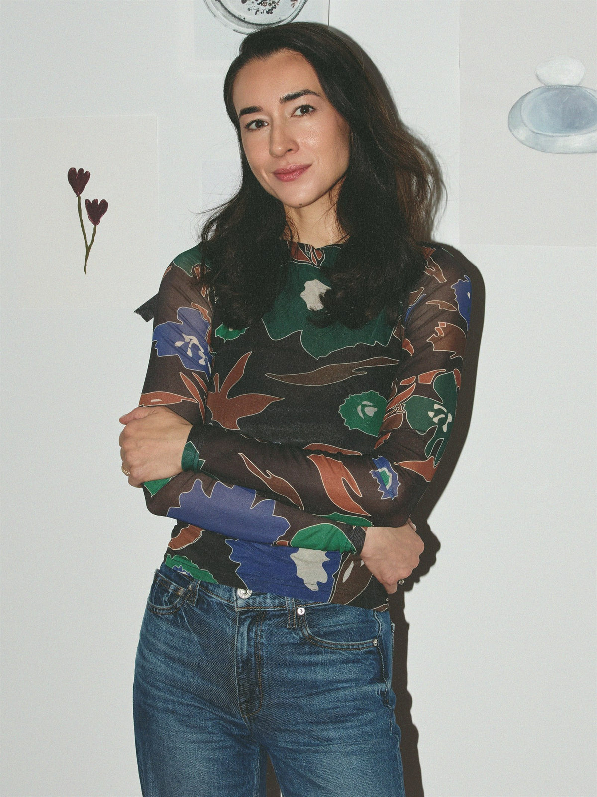 Jasmina Aganovic, founder of Arcaea Labs, arms folded.