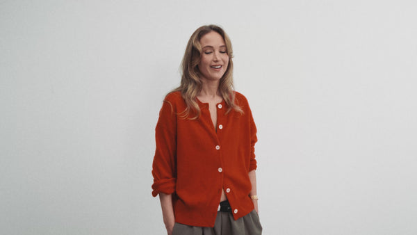 Founder film: Jennifer Lawrence in a red cardigan in the studio.
