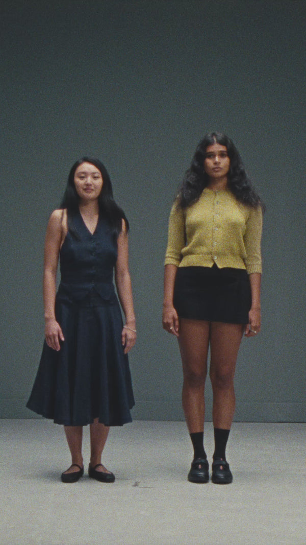 Portrait film of Vishwa and Lindsay, two cast members, standing side by side in the studio.